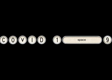 Covid-19 in de letters van een oude typemachine, met een lange spatie "space" tussen de 1 en de 9